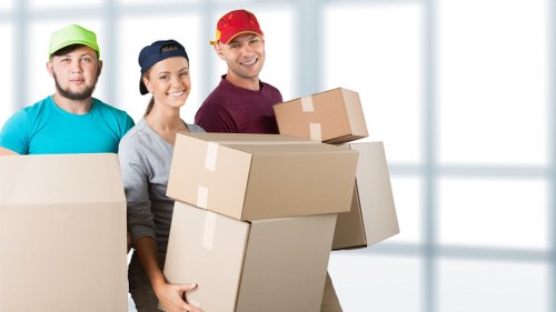 Packed boxes and furniture ready for loading during a home move