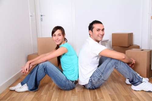 Local removal van loading furniture near a flat or house in Redbridge