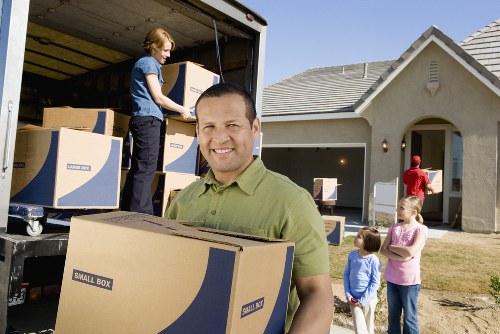 Packed boxes and furniture ready for transport in Redbridge