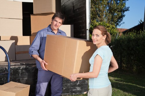 A Redbridge moving team assisting with a home relocation and furniture placement at the new property