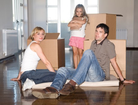 Packed moving boxes and furniture ready for local removal services