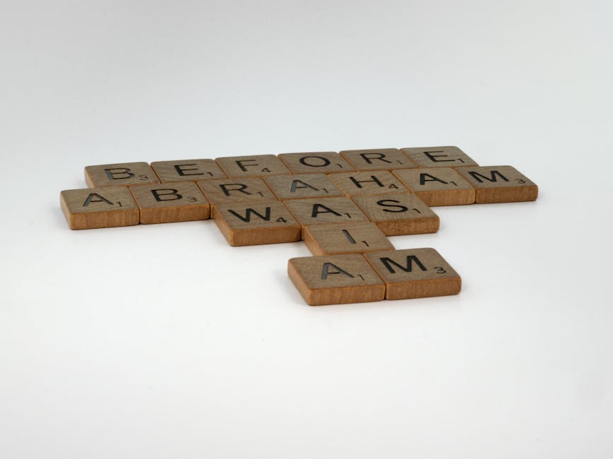 A collection of small wooden Scrabble tiles arranged to form the message 'BEFORE ARRANGEMENTS' on a plain white surface, with the tiles slightly overlapping and aligned in a crossword pattern. Some tiles display black letters and point values, with the words placed horizontally and vertically intersecting at the letter 'A'. The background is minimal and neutral, emphasizing the tiles, which are associated with planning and textual messaging relevant to home relocation or packing processes. This visual may be used to illustrate the importance of checking details in accurate moving quotes, such as hidden fees in van services, as provided by Man With a Van Redbridge. The setting appears in a professional, indoor environment, with natural lighting highlighting the wood texture and contrasting the background to ensure clear accessibility.